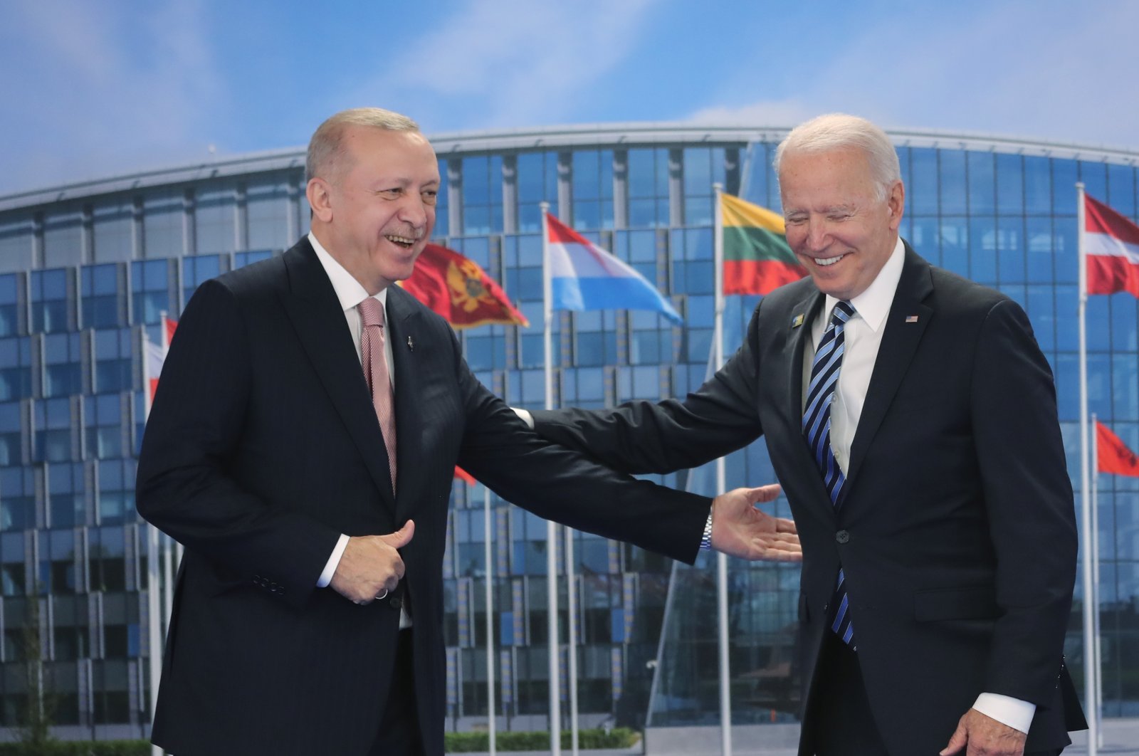 President Recep Tayyip Erdoğan and his U.S. counterpart Joe Biden gesture during their meeting at the NATO headquarters in Brussels, Belgium, June 14, 2021. (DHA Photo)