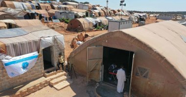 People enter a tent turned into a vaccination center at a camp for the internally displaced near Marret Misrin town, in northwestern Syria's Idlib, Syria, June 14, 2021. (AFP Photo)