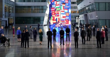 NATO heads of the states and governments look at a digital installation after posing for a family photo, during the NATO summit at the alliance's headquarters in Brussels, Belgium, June 14, 2021. (Reuters Photo)