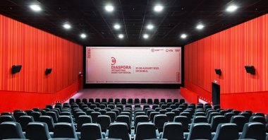 A panoramic view of an empty cinema hall with a screen. (Shutterstock Photo) 
