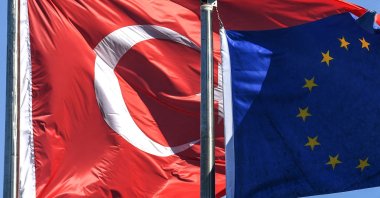 The Turkish and European Union flags flutter in the wind of the Maslak financial and business district in Istanbul, Turkey, Aug. 15, 2018. (AFP Photo)