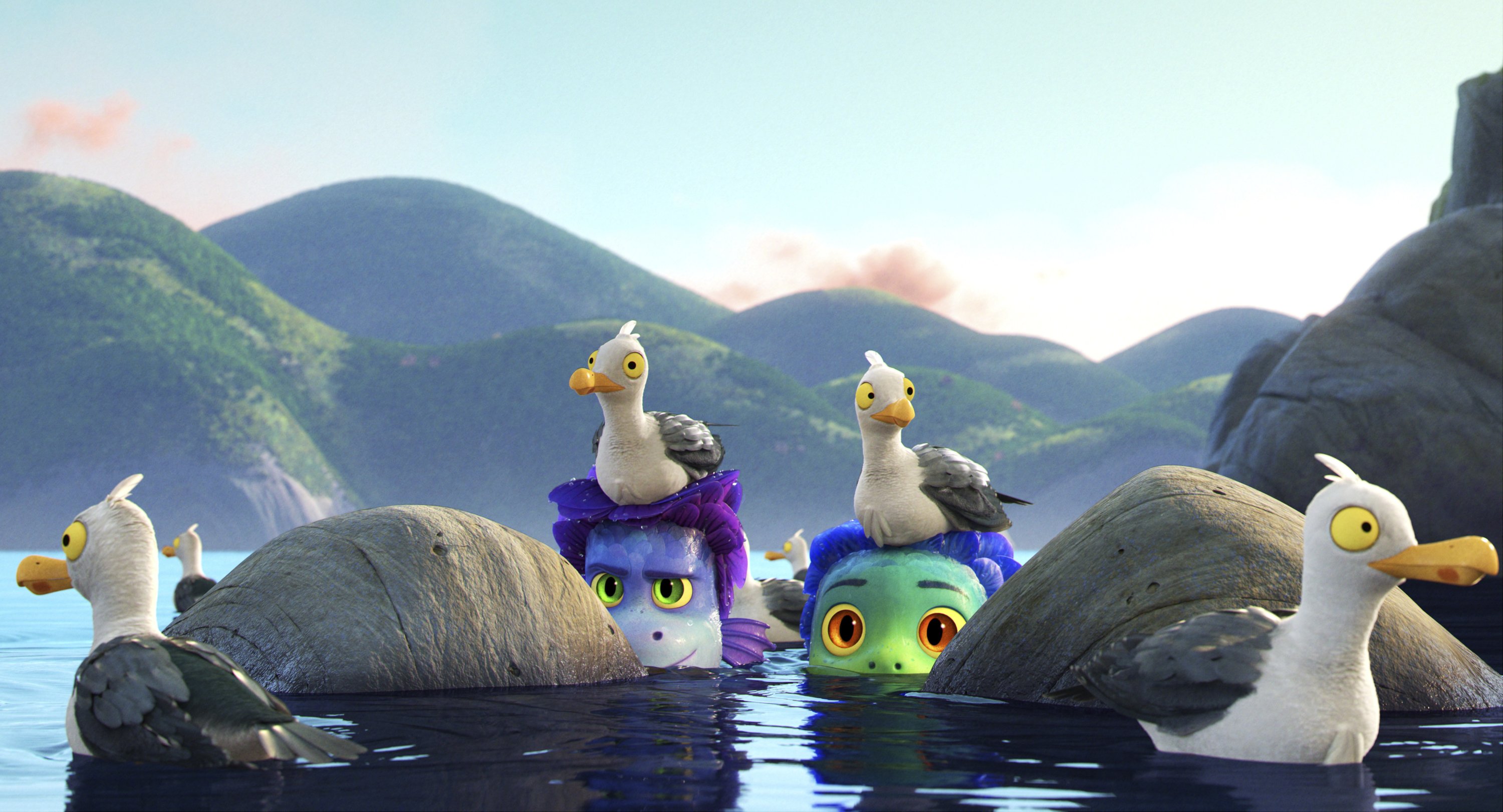 Alberto, voiced by Jack Dylan Grazer (C-L), and Luca, voiced by Jacob Tremblay (C-R), come out of the water as they are surrounded by seagulls in a scene from the animated film "Luca." (Photo by Disney via AP)