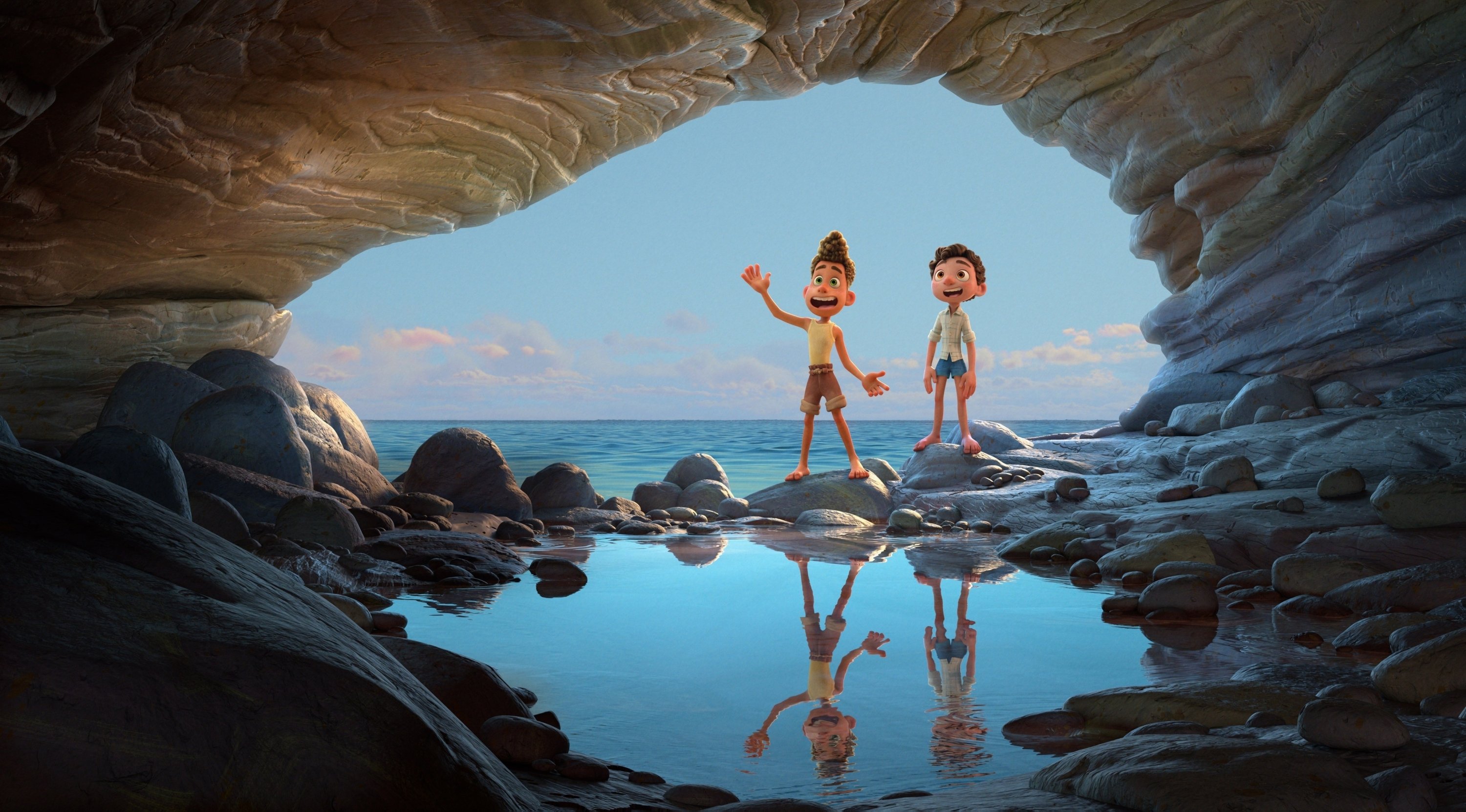 Alberto, voiced by Jack Dylan Grazer (L), and Luca, voiced by Jacob Tremblay, walk into a cave in a scene from the animated film 'Luca.' (Photo by Disney via AP)