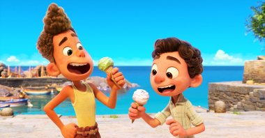 Alberto, voiced by Jack Dylan Grazer (L), and Luca, voiced by Jacob Tremblay, eat ice cream in a scene from the animated film "Luca." (Photo by Disney via AP)