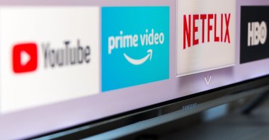 Logos of several streaming services, including YouTube, Amazon Prime Video, Netflix and HBO, are displayed on a television screen, Madrid, Spain, Aug. 13, 2018. (Shutterstock Photo)