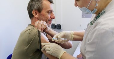 A man receives a dose of Sputnik V vaccine against the coronavirus at a mobile vaccination center in a dacha community near the village of Poyarkovo in Moscow Region, Russia, May 31, 2021. (Reuters Photo)
