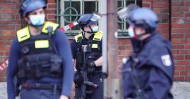 Armed policemen stand in front of the Senate Department for Health, Care and Equality building, in Berlin, Germany, 01 June 2021. (EPA Photo)