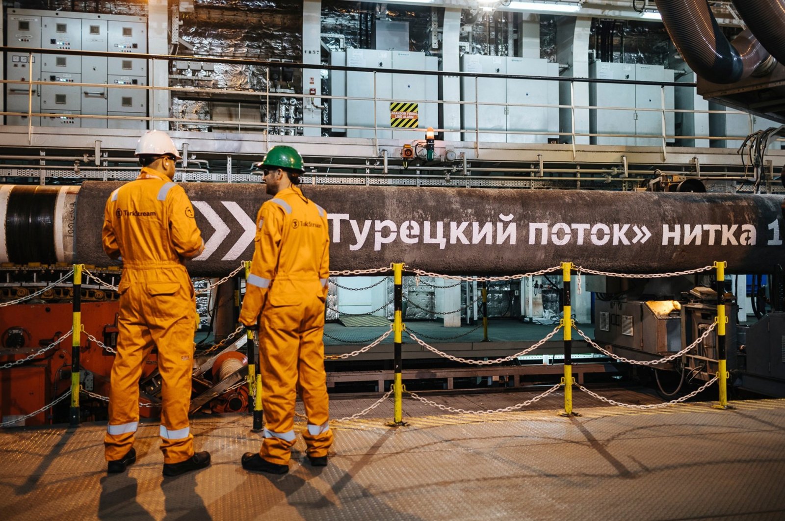 This file photo shows workers in front of pipes to be laid on the Black Sea seabed by the vessel Pioneering Spirit as part of the TurkStream gas pipeline project, Feb. 5, 2018. (AA Photo)