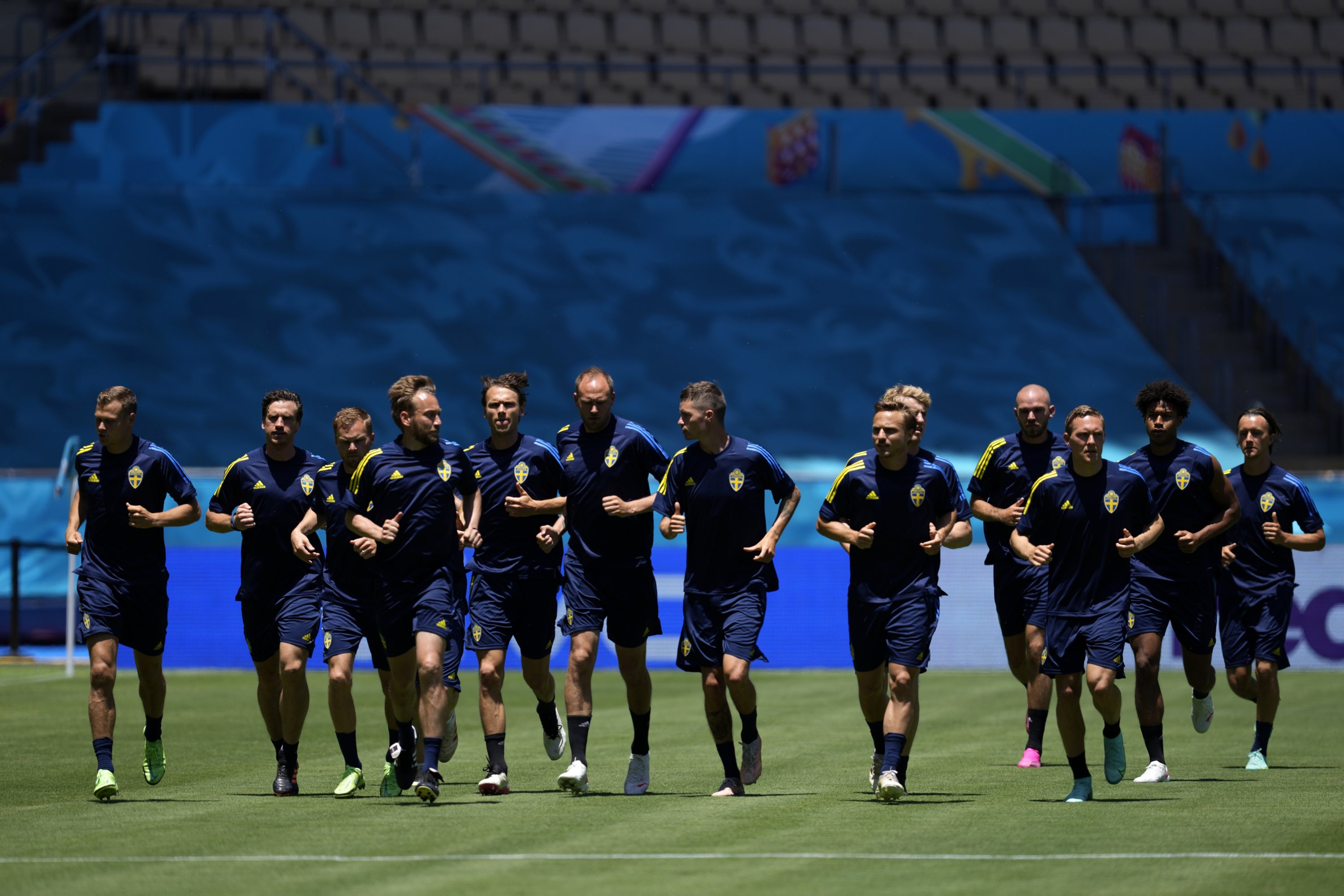 Swedish players run during a training session at the La Cartuja stadium in Seville, Spain, June 13, 2021. (AP Photo)