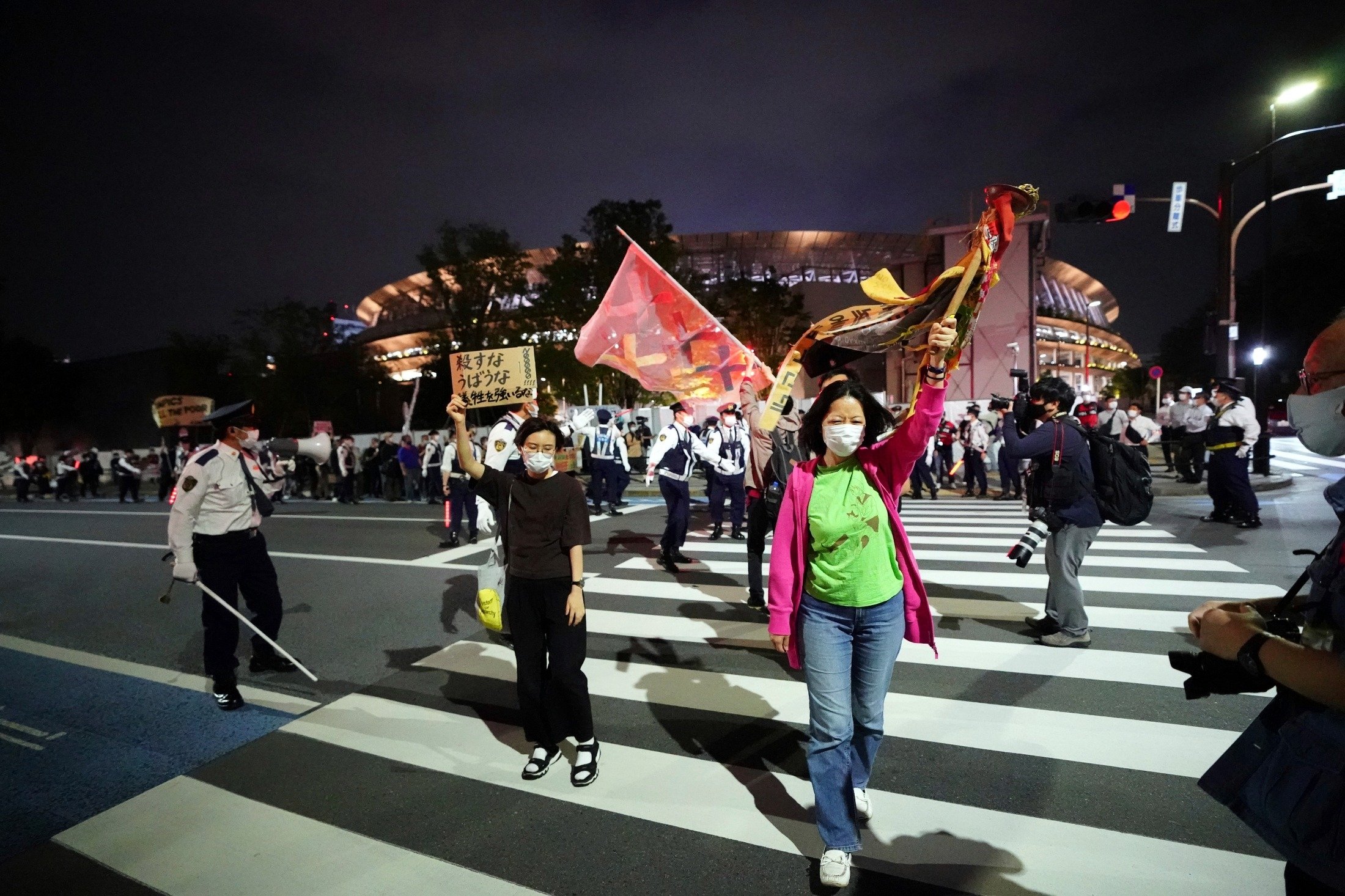 People against the Tokyo 2020 Olympics set to open in July, march to protest around Tokyo's National Stadium during an anti-Olympics demonstration, Tokyo, Japan, May 9, 2021. (AP Photo)