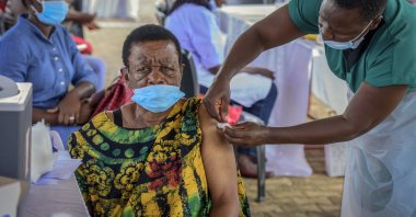 A woman receives a coronavirus vaccination at the Kololo airstrip in Kampala, Uganda, May 31, 2021. (AP Photo)