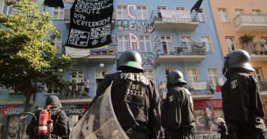 Police stand in front of the "Rigaer 94" squat at the Rigaer Straße (Riga Street) in Berlin, Germany, June 18, 2021. (AP Photo)