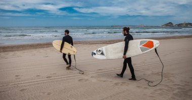 Wave surfers carry their surfboards in Şile, Istanbul, Turkey, May 19, 2017. (Photo by Shutterstock)