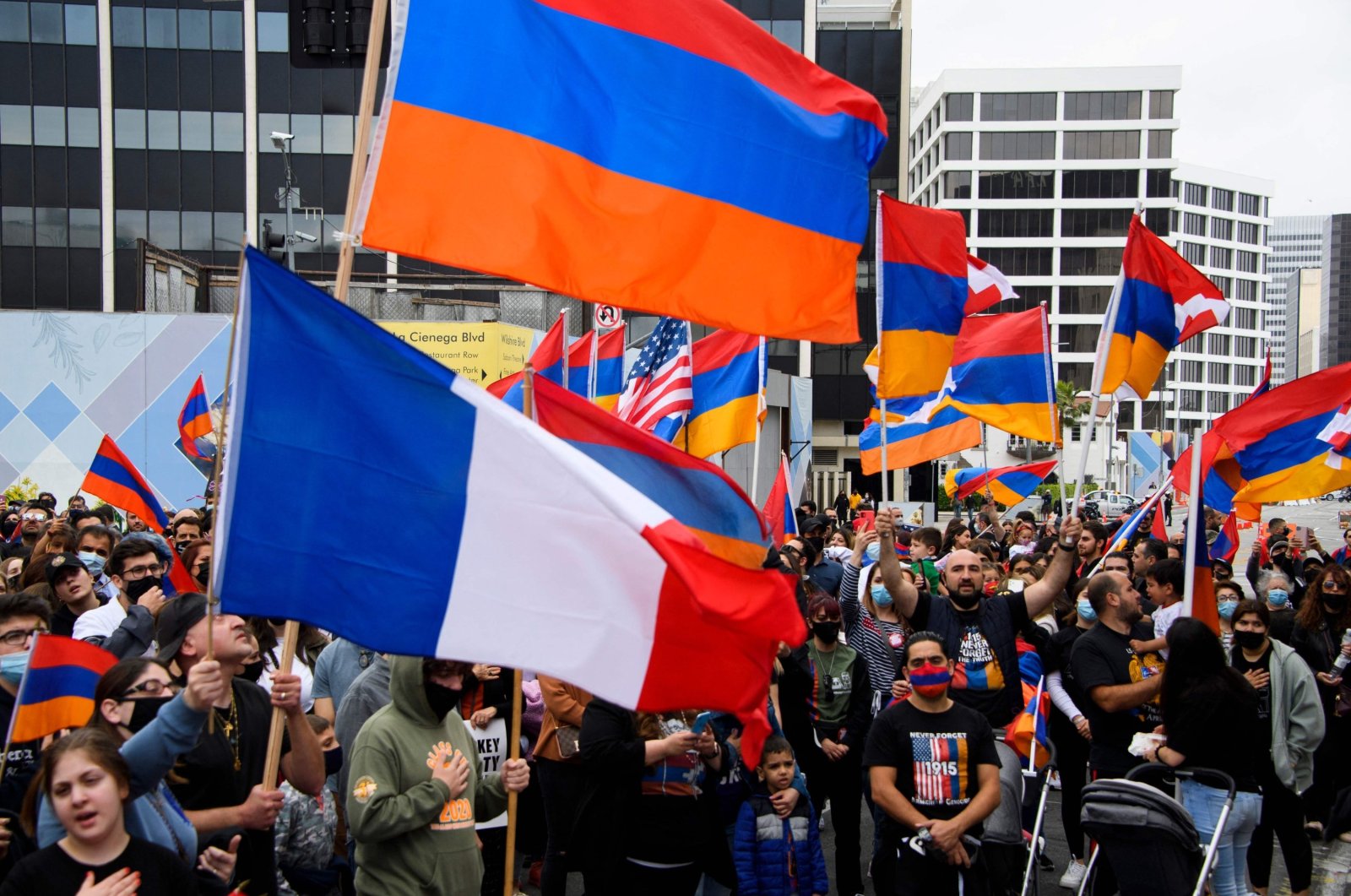 A French flag is waved alongside Armenian flags as people protest outside of the Turkish Consulate on the anniversary of the 1915 events in a demonstration organized by the Armenian Youth Federation (AYF) in Beverly Hills, California, U.S., April 24, 2021. (AFP File Photo)