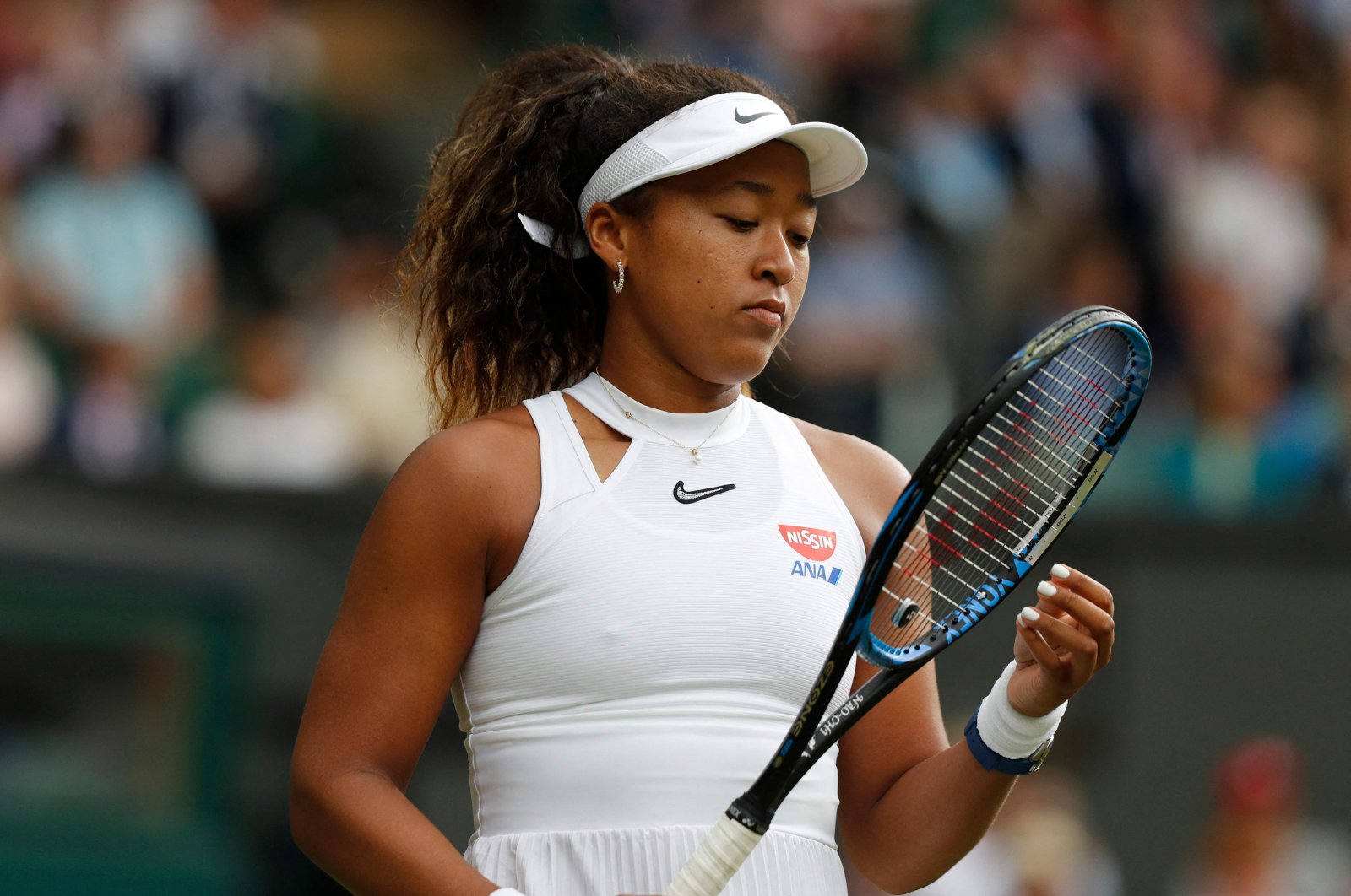 Japan's Naomi Osaka reacts after a point against Kazakhstan's Yulia Putintseva during their women's singles first round match on the first day of the 2019 Wimbledon Championships at The All England Lawn Tennis Club in Wimbledon, southwest London, July 1, 2019. (AFP Photo)