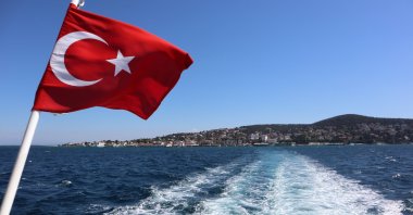 The Turkish flag waves on a Bosporus ferry from Büyükada in the Marmara Sea, Istanbul, Turkey, March 12, 2019. (Photo by Shutterstock)