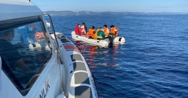 A coast guard boat helps irregular immigrants off the coast of Ayvalık, in Balıkesir, western Turkey, June 5, 2021. (AA PHOTO)