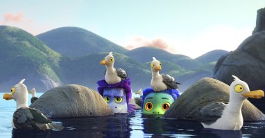 Alberto (C-L), voiced by Jack Dylan Grazer, and Luca (C-R), voiced by Jacob Tremblay, come out of the water as they are surrounded by seagulls in a scene from the animated film "Luca." (Photo by Disney via AP)