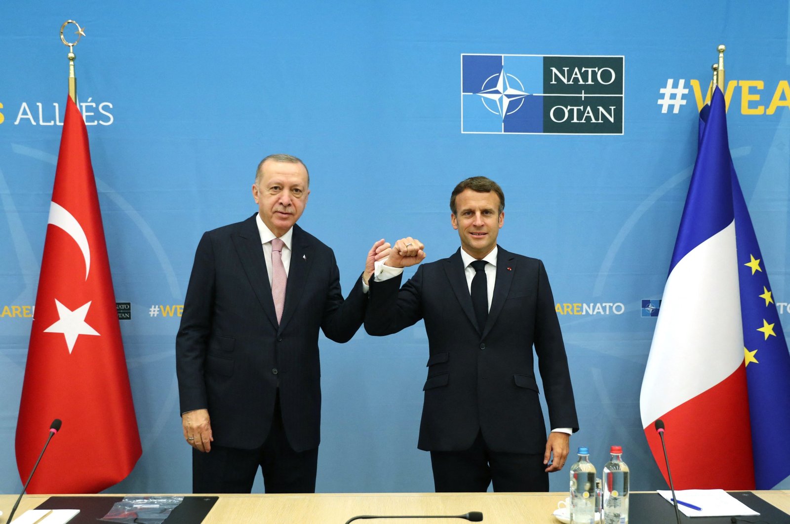 President Recep Tayyip Erdoğan (L) meets with his French counterpart Emmanuel Macron (R) during a bilateral meeting on the sidelines of the NATO summit in Brussels, Belgium, June 14, 2021. (AFP Photo)