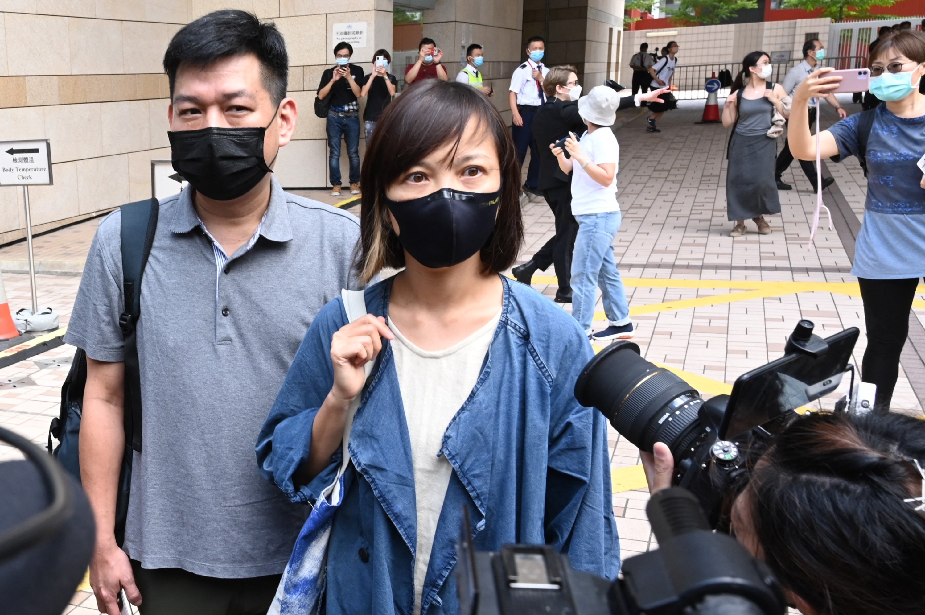 Apple Daily Deputy Dhief Editor Chan Pui-man (C) speaks to the media as she leaves court as fellow executives from the pro-democracy newspaper, Chief Editor Ryan Law and CEO Cheung Kim-hung were remanded in custody in Hong Kong, China, June 19, 2021. (AFP Photo)