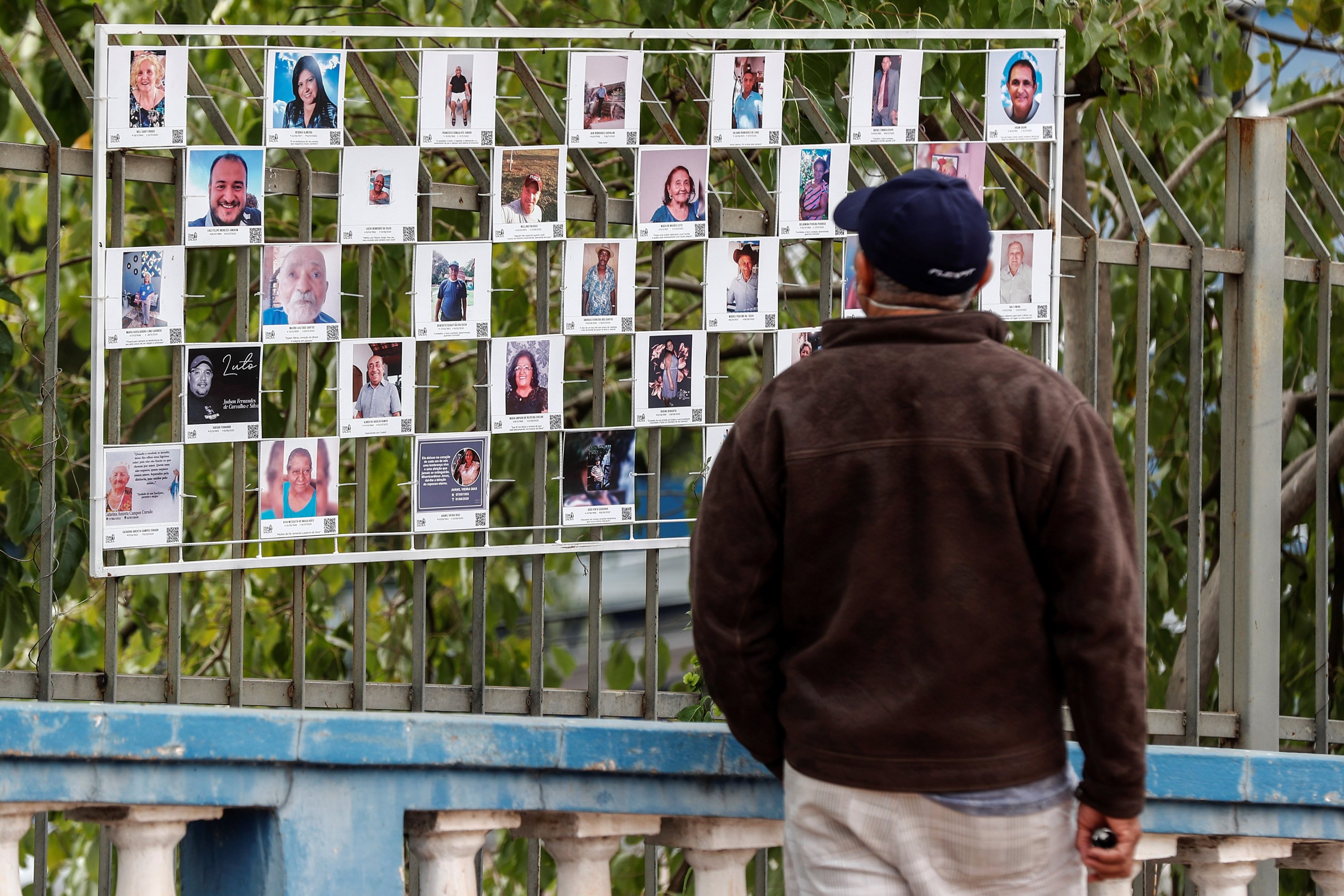 A man observes some photographs in the "Inmensurables" (Immeasurable) exhibition that is part of the memorial of the victims of COVID-19, in Cuiaba, in the state of Mato Grosso, Brazil, June 19, 2021. (EPA Photo)