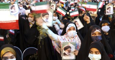 Supporters of Iranian president-elect Ebrahim Raisi celebrate after he won the presidential election in Tehran, Iran, Saturday, June 19, 2021. (AP Photo)