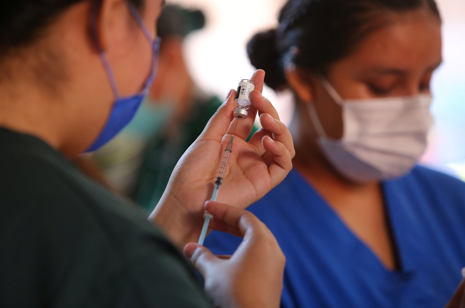 Health care workers prepare Johnson & Johnson vaccines against COVID-19, as part of a government plan to inoculate Mexican border residents on its shared frontier with the United States, in Tijuana, Mexico, June 17, 2021. (Reuters Photo)
