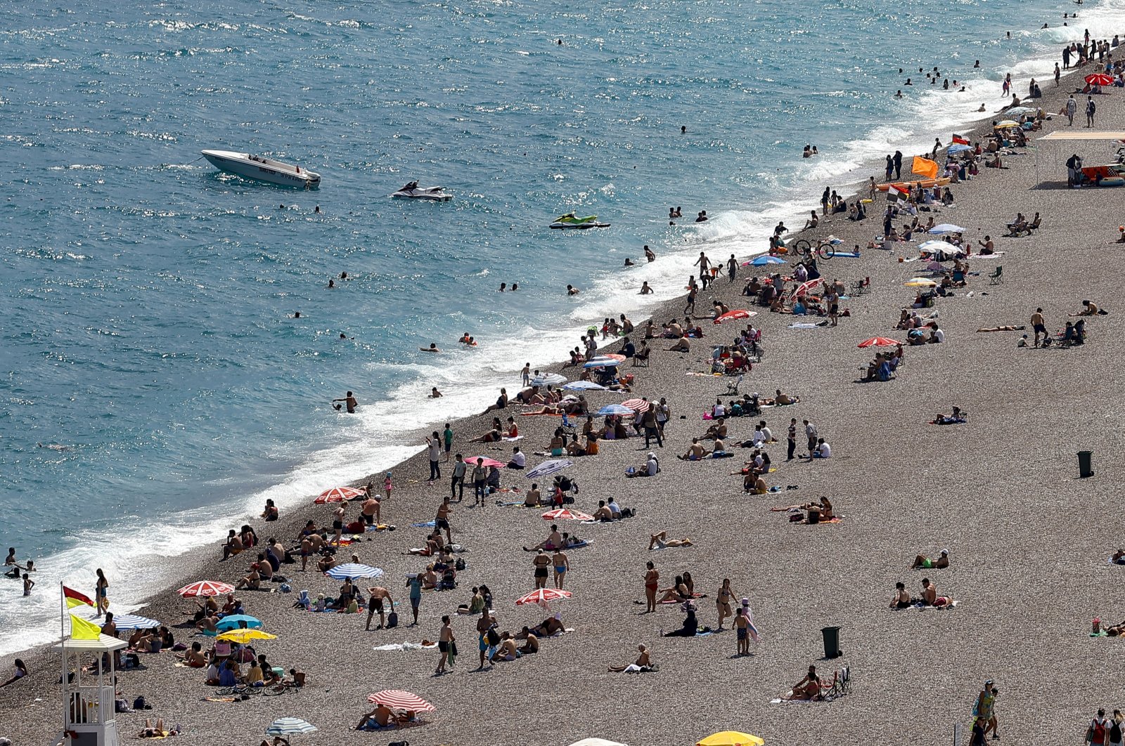 People are seen on a beach in the southern Mediterranean resort city of Antalya, Turkey, June 12, 2021. (AA Photo)