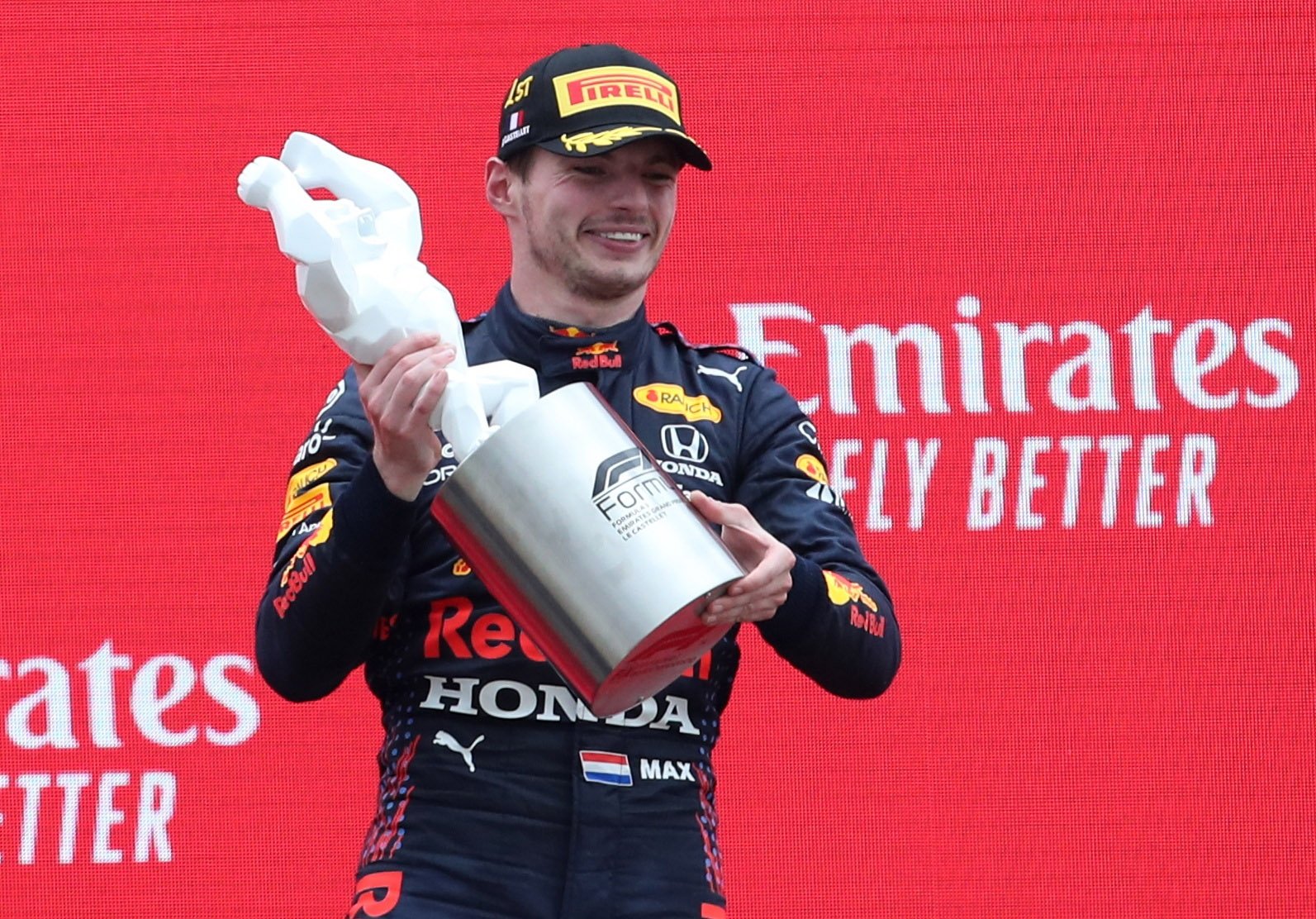 Red Bull's Max Verstappen celebrates with a trophy on the podium after winning the Formula One French Grand Prix at Circuit Paul Ricard, Le Castellet, France, June 20, 2021. (Reuters Photo)