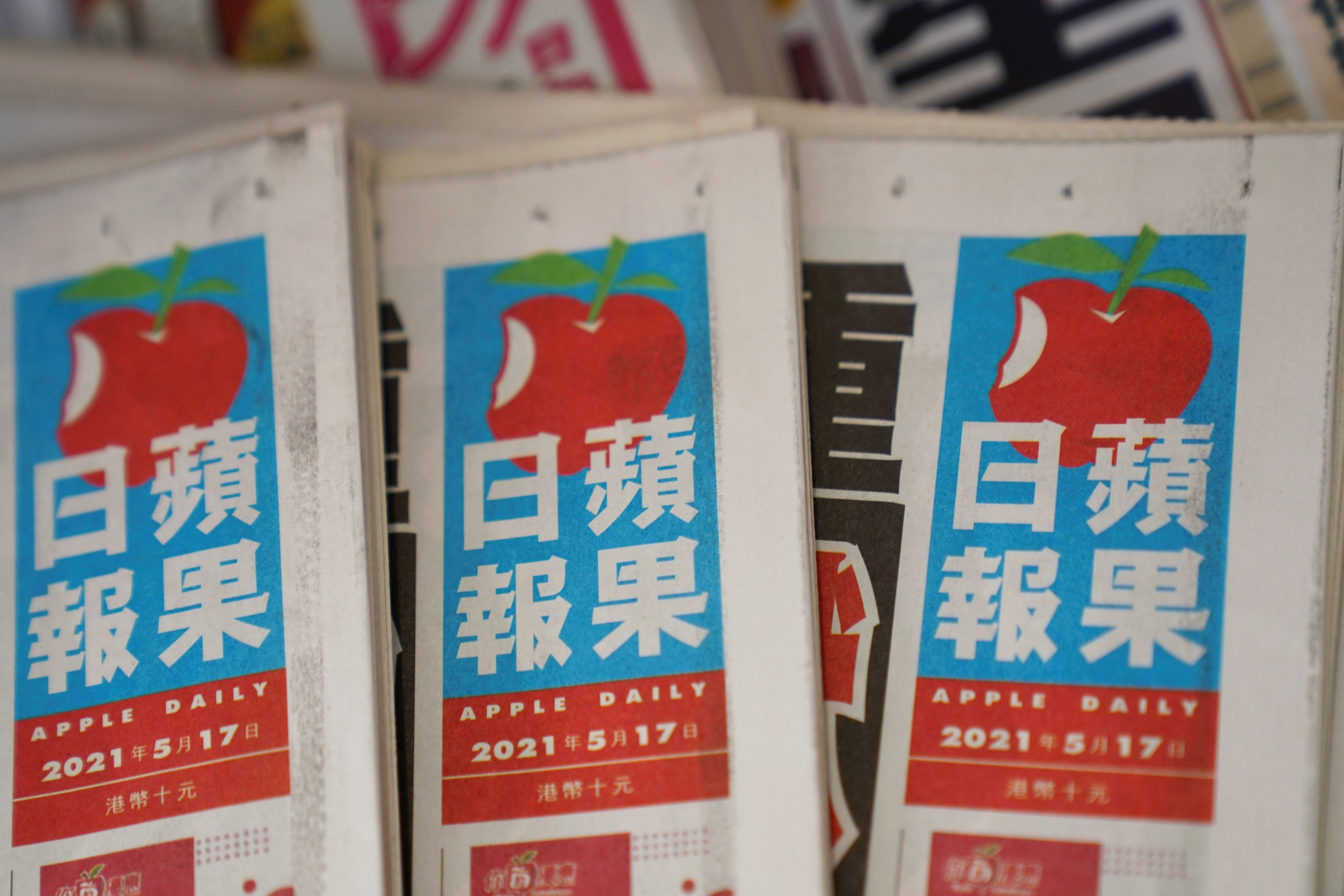 A newsstand displays copies of Next Digital's Apple Daily newspapers in Hong Kong, China, May 17, 2021. (REUTERS)