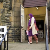 A Muslim British woman leaves a polling station after voting in an election, Dewsbury, West Yorkshire, U.K., May 8, 2005. (Shutterstock Photo)