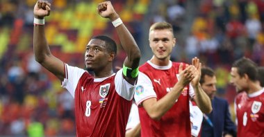 Austria's defender David Alaba (L) celebrates after winning the UEFA EURO 2020 Group C football match between Ukraine and Austria at the National Arena in Bucharest, Romania, June 21, 2021. (AFP Photo)