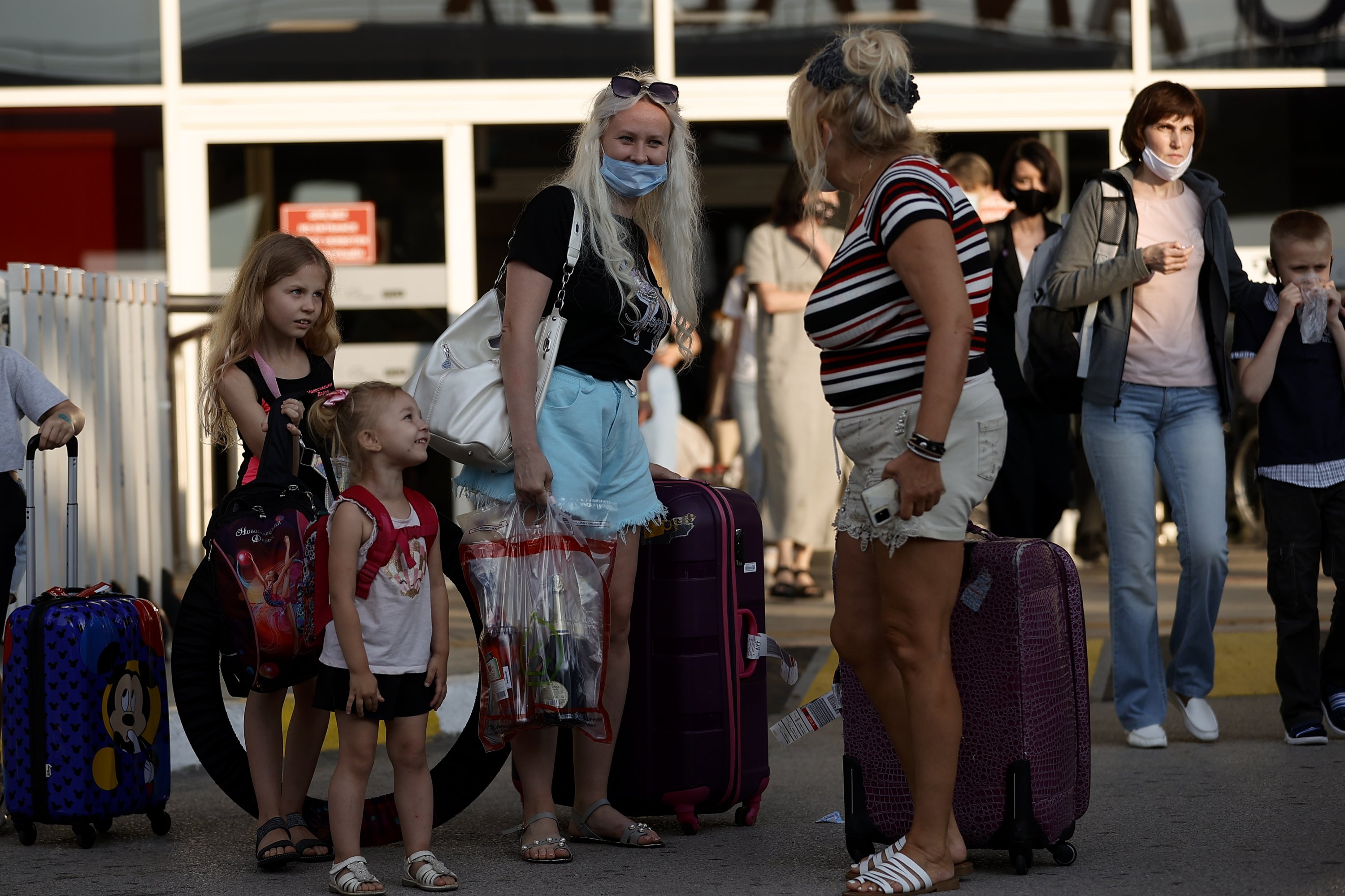 Russian tourists exit the airport as they arrive in the southern province of Antalya, Turkey, June 22, 2021. (AA Photo)