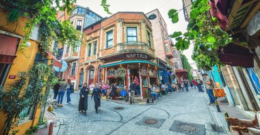 People mill about in the colorful streets and cafes of the Balat neighborhood in Istanbul, Turkey, Oct. 20, 2018. (Shutterstock Photo)
