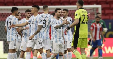 Argentina's players greet each other at the end of a Copa America match against Paraguay at the National Stadium in Brasilia, Brazil, June 21, 2021. (AP Photo)
