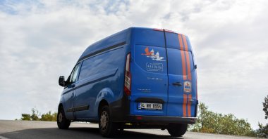 A cargo van belonging to MNG Kargo drives on the road in Marmaris district of Muğla, southwestern Turkey, Nov. 10, 2019. (Shutterstock Photo)