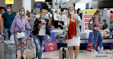 Russian tourists walk at an airport in the southern province of Antalya, Turkey, June 22, 2021. (AA Photo)