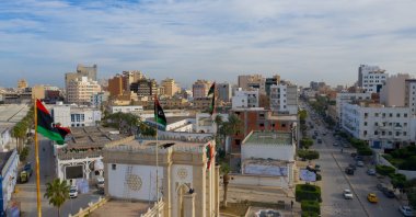 An aerial view with national flags in the background, Tripoli, Libya, Dec. 27, 2020. (Shutterstock Photo)