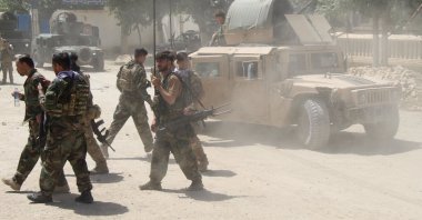 Afghan commando forces move about at the site of a battlefield where they clashed with Taliban insurgents, in Kunduz province, Afghanistan, June 22, 2021. (Reuters Photo)