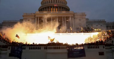 An explosion caused by a police munition is seen while supporters of U.S. President Donald Trump gather in front of the U.S. Capitol Building in Washington, U.S., Jan. 6, 2021. (Reuters Photo)