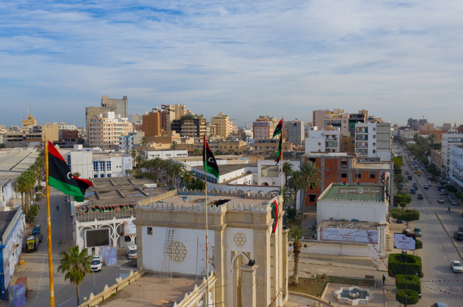 An aerial view with national flags in the background, Tripoli, Libya, Dec. 27, 2020. (Shutterstock Photo)