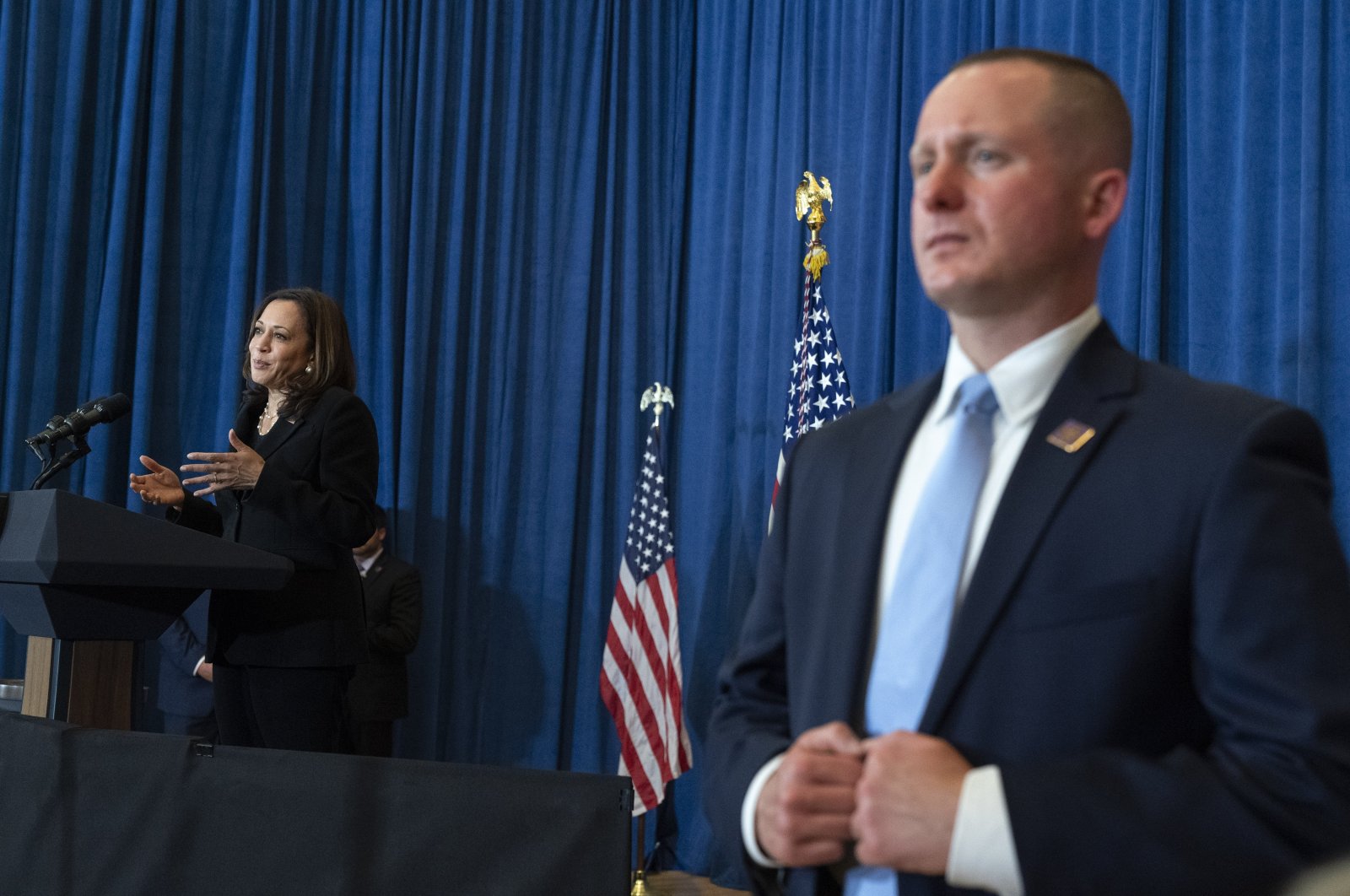 Vice President Kamala Harris speaks about the child tax credit during an event at Brookline Memorial Recreation Center as a Secret Service agent (R) stands beside her, Pittsburgh, U.S., June 21, 2021. (AP Photo)