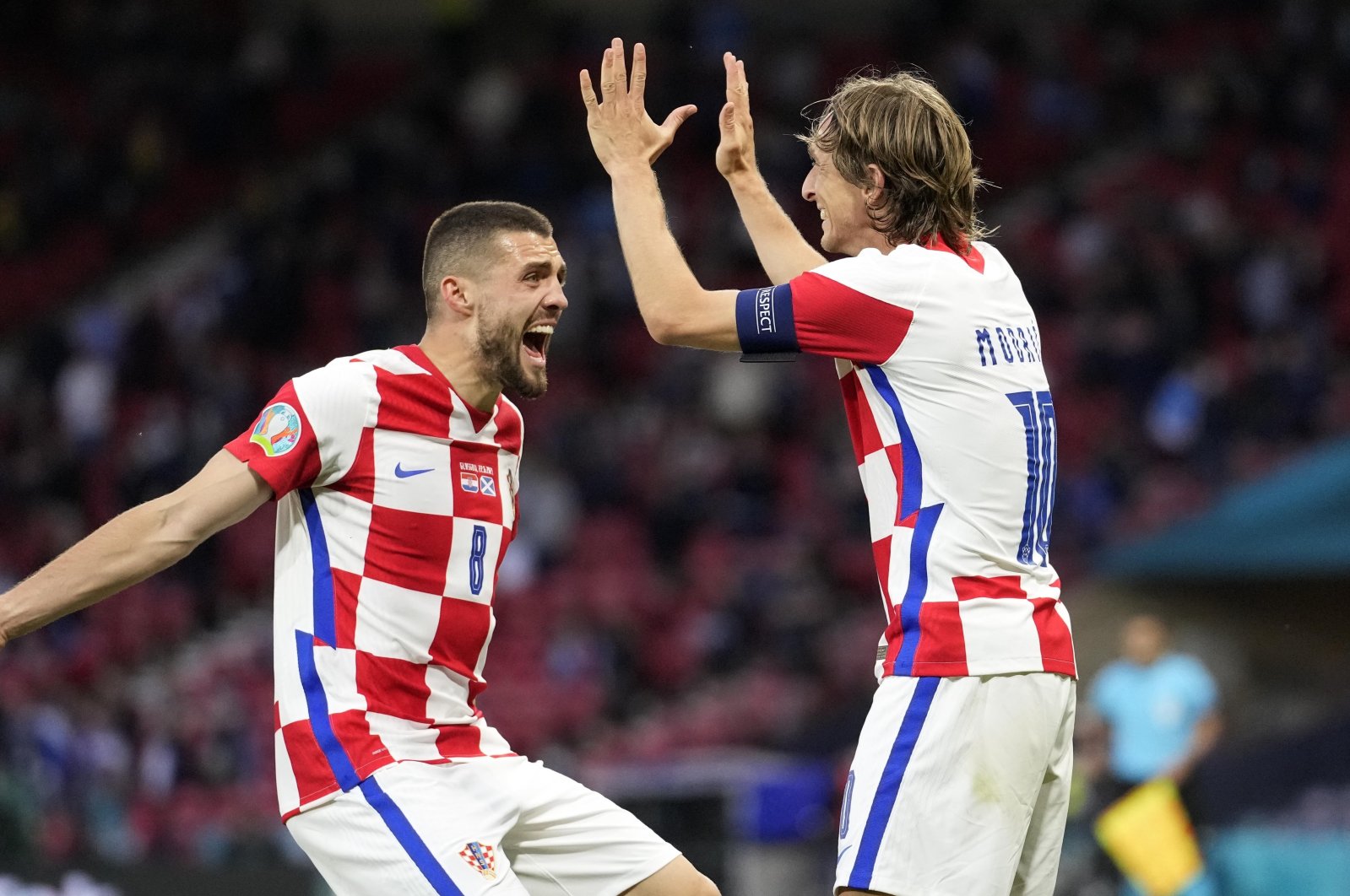 Croatia's Mateo Kovacic (L) and Luka Modric celebrate after Ivan Perisic scored their third goal during the Euro 2020 Group D match against Scotland at the Hampden Park Stadium, Glasgow, Scotland, June 22, 2021. (AP Photo)