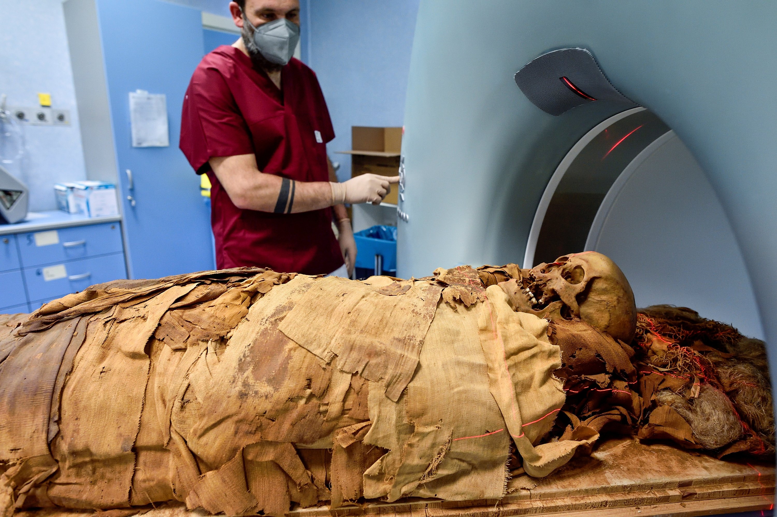 A medical radiology technician prepares a CT scan to do a radiological examination of an Egyptian mummy in order to investigate its history at the Policlinico hospital in Milan, Italy, June 21, 2021. (Reuters Photo)