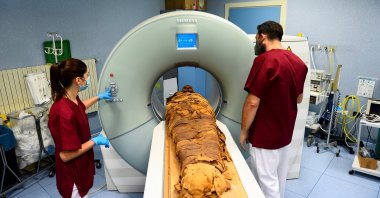 Medical radiology technicians prepare a CT scan to do a radiological examination of an Egyptian mummy in order to investigate its history at the Policlinico hospital in Milan, Italy, June 21, 2021. (Reuters Photo)