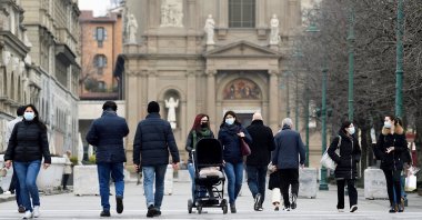 People walk on a street a year after the peak of Italy's coronavirus outbreak, in Bergamo, the country's epicenter, Italy, March 3, 2021. (Reuters Photo)