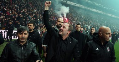 Beşiktaş manager Sergen Yalçın (C) reacts to the fans celebrating the club's domestic double at the Vodafone Park, Beşiktaş, Istanbul, May 19, 2021. (IHA Photo)
