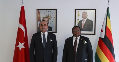 Turkish Foreign Minister Mevlüt Çavuşoğlu poses with his Zimbabwean counterpart Frederick Shava at the opening ceremony of Zimbabwe's Embassy in Ankara, Turkey, June 13, 2021. (AA Photo)