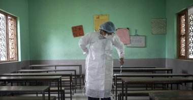 A health worker prepares to administer a second dose of Covishield COVID-19 vaccine at Karyabinayak School in Lalitpur, Nepal, June 23, 2021. (EPA Photo)