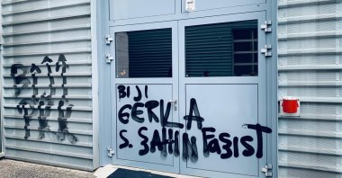 Propaganda painted by pro-PKK protesters tags a company owned by the Global Turkish Business Council in Switzerland. (AA Photo)